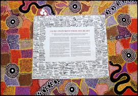 Colorful Indigenous artwork surrounds a central text box titled 'Uluru Statement From the Heart,' featuring serpentine shapes and dot patterns.