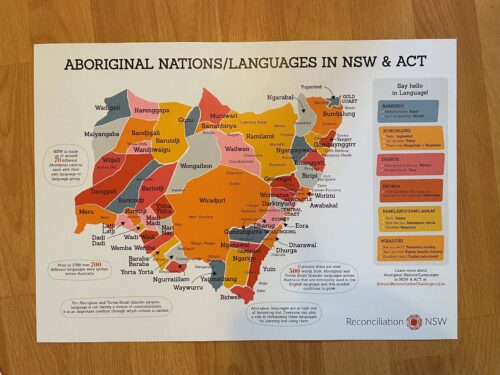 Map of Aboriginal nations and languages in NSW and ACT. Color-coded regions with labels. Sidebar includes greetings in various Aboriginal languages.